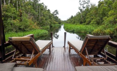 relaxing riverside deck with lounge chairs
