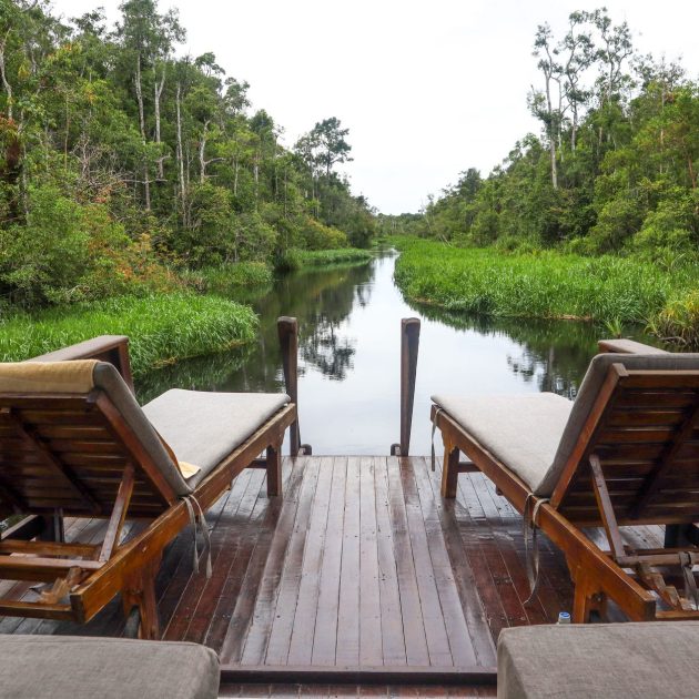 relaxing riverside deck with lounge chairs