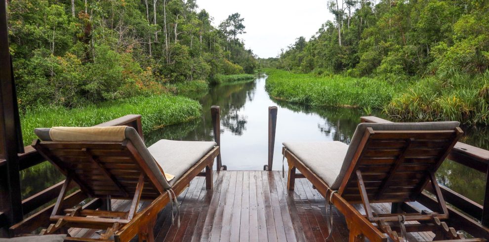 relaxing riverside deck with lounge chairs