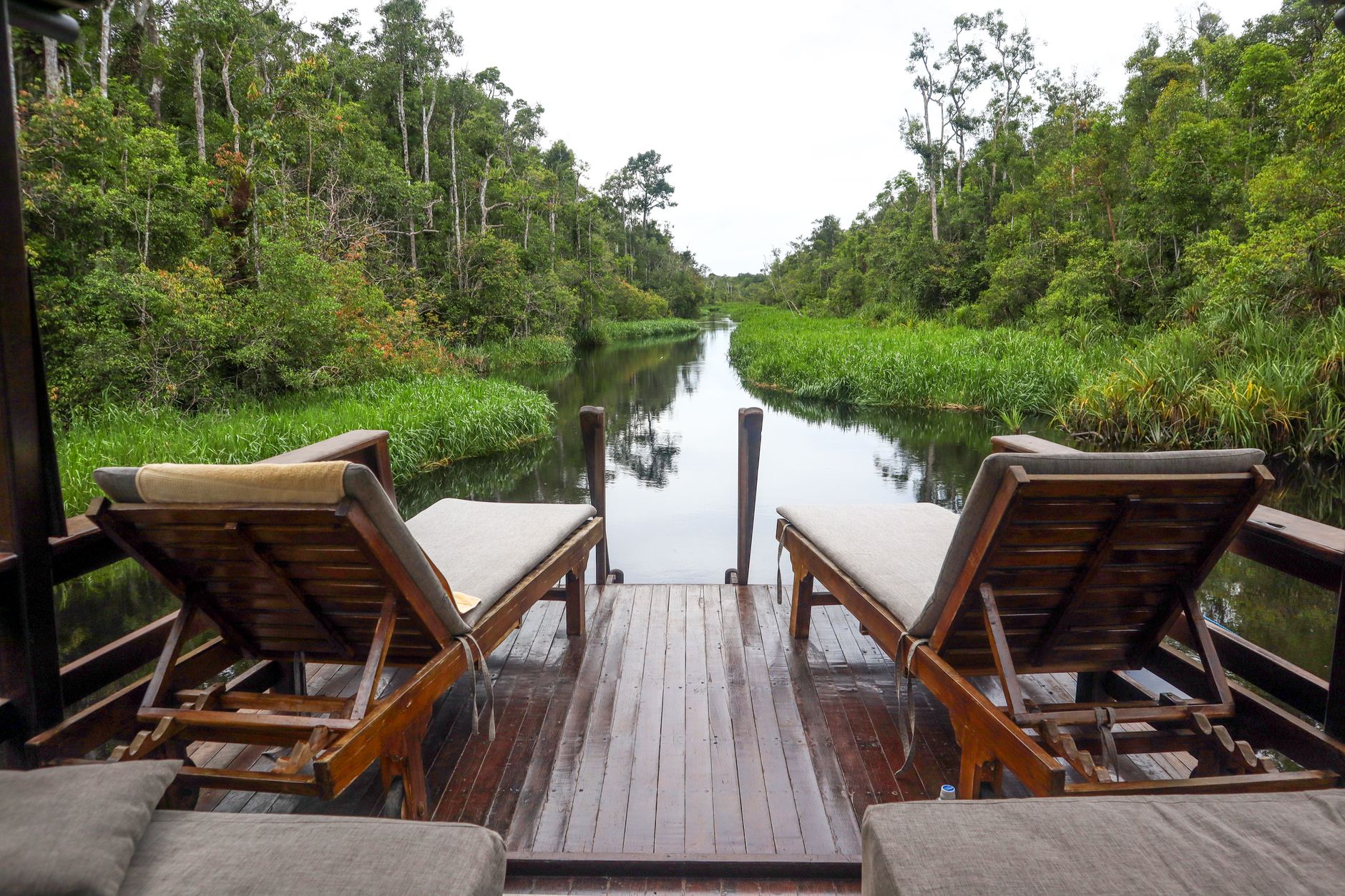 relaxing riverside deck with lounge chairs