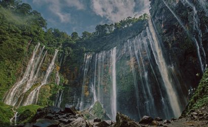 spectacular waterfall in lush green forest