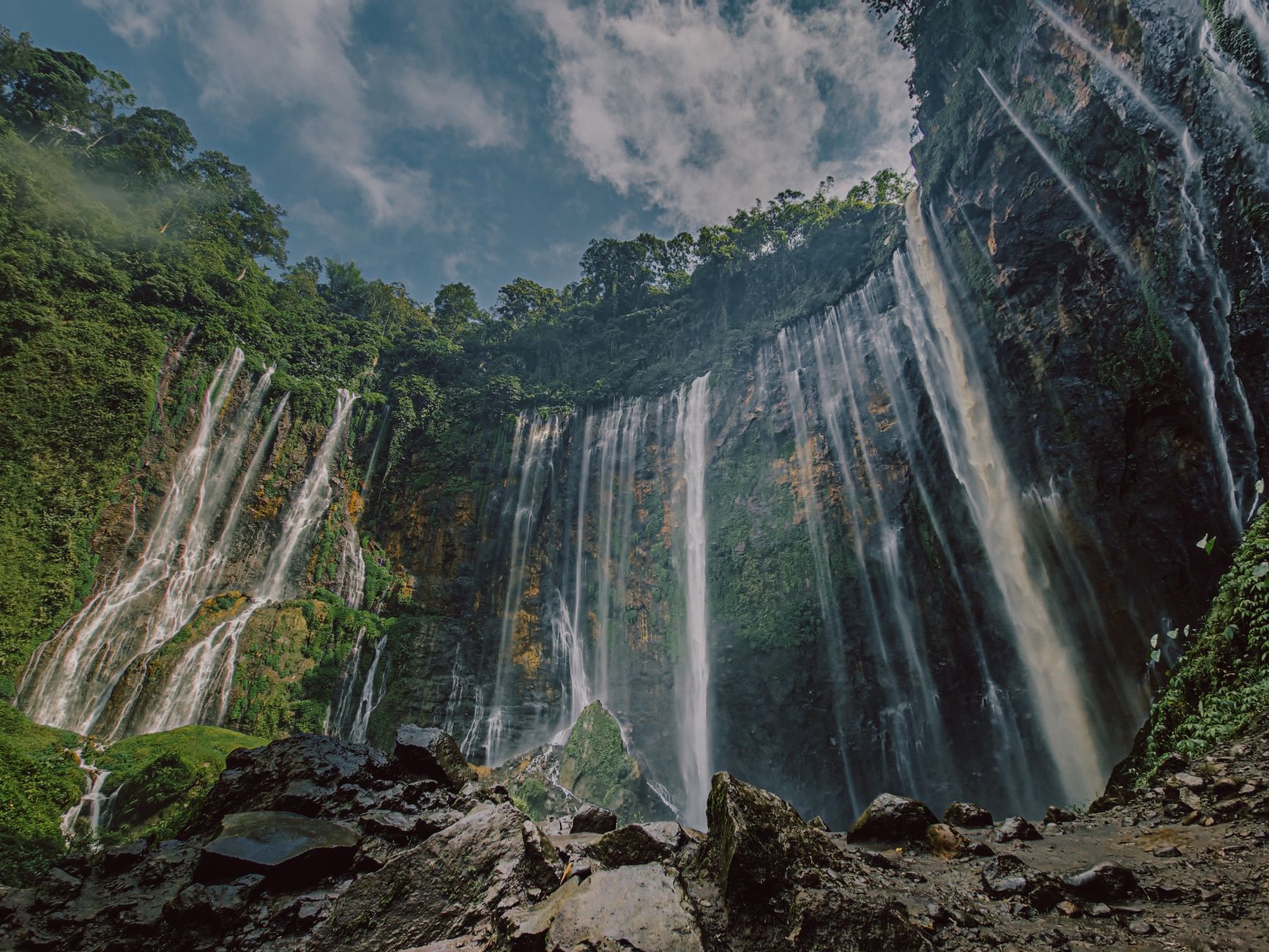 spectacular waterfall in lush green forest